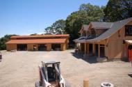 80 foot by 40 foot barn. Outside trim, 12 inch/3 inch board and batten siding. Approximately one and a half MILES of redwood boards in barn.